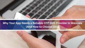 Person choosing otp sms provider using his phone with a laptop background
