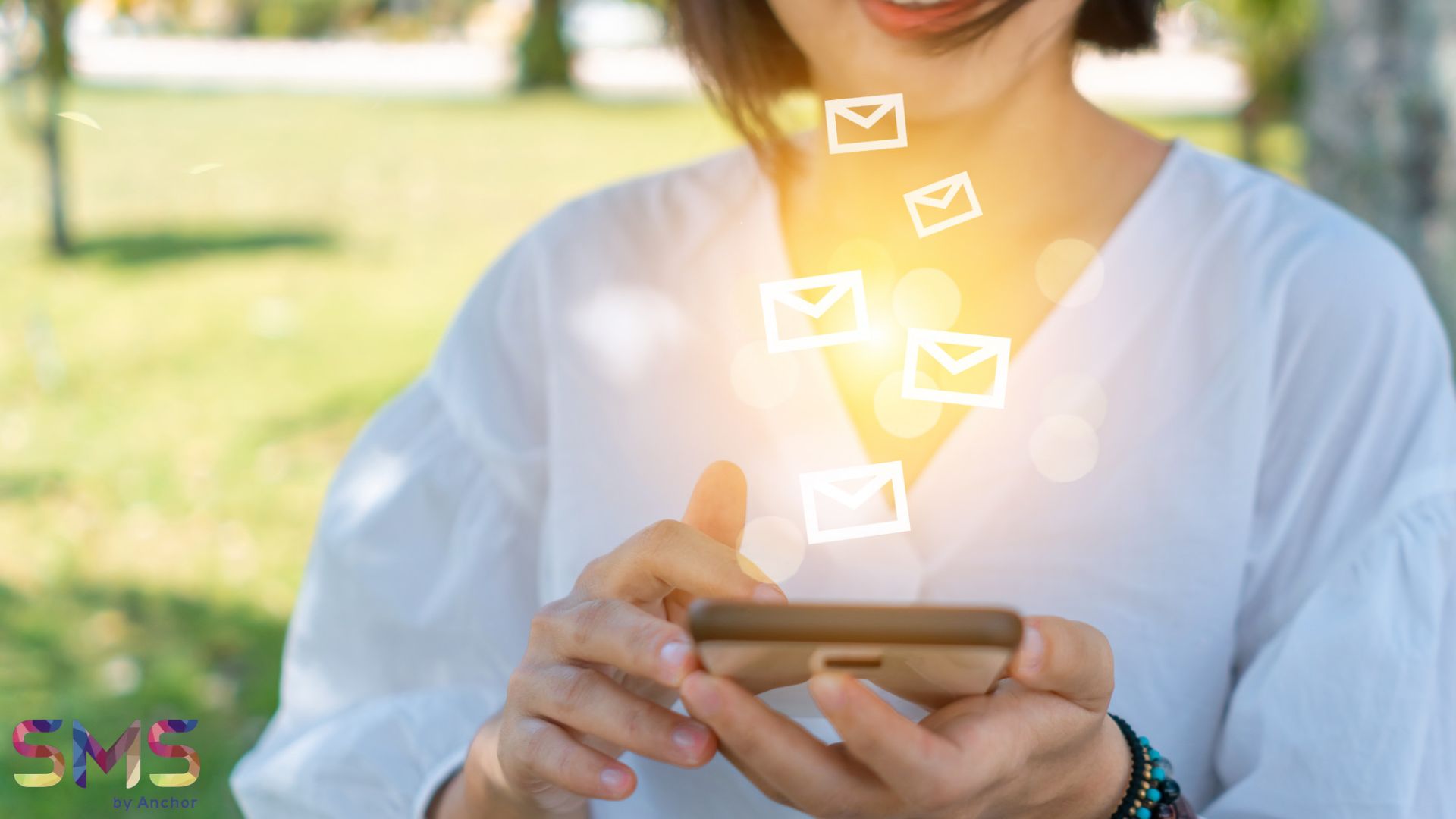Woman using smartphone to send and recieve SMS marketing for business.